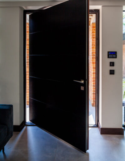 Black Spitfire pivot door opening inwards - Glazerite uPVC