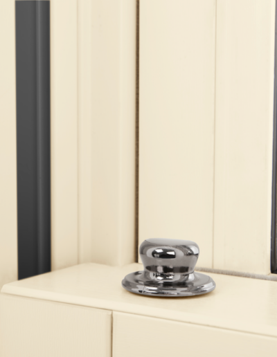 Close up of a cream sliding sash window - Glazerite uPVC