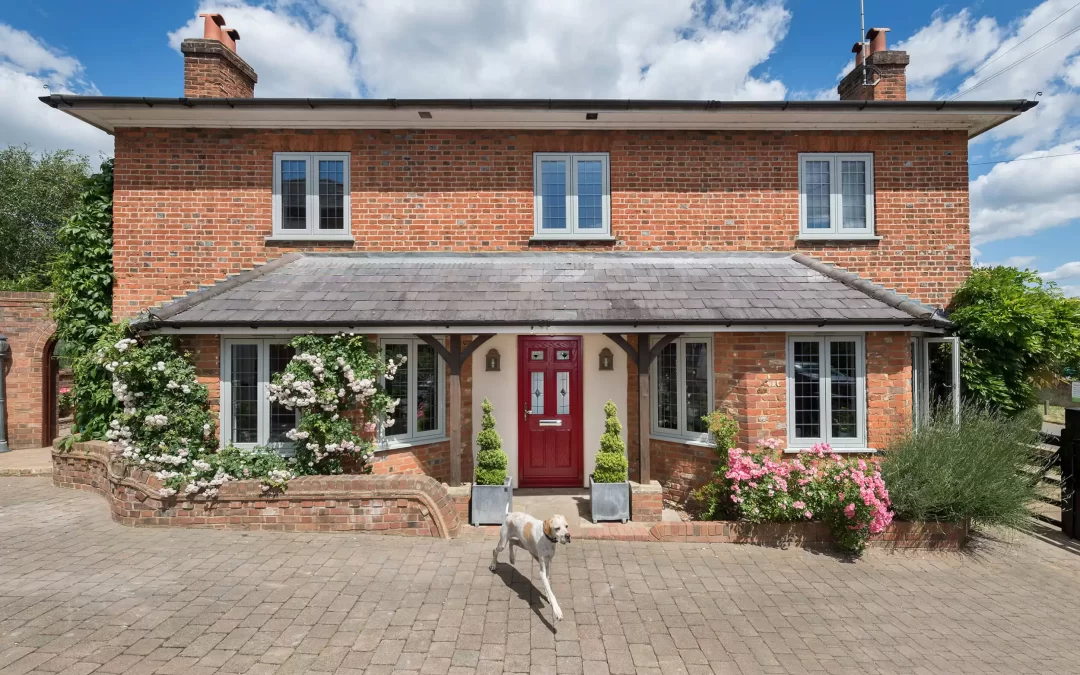 Property with new red composite entrance door and agate grey flush casement windows - Glazerite uPVC