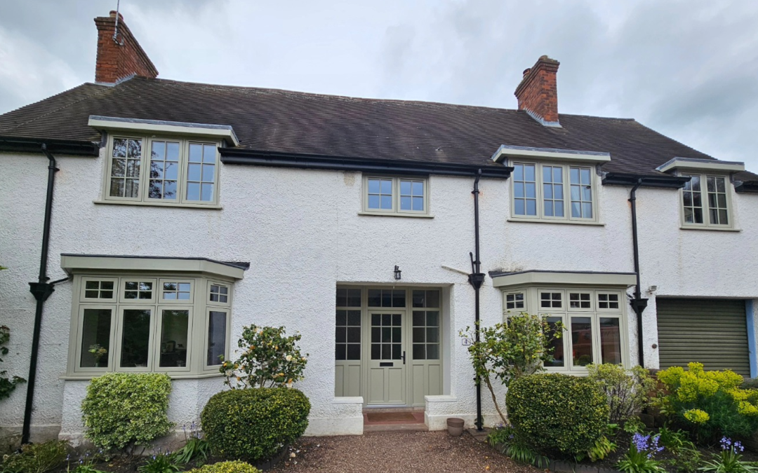 Pebble grey flush casement windows and doors on white rendered house finish - Glazerite uPVC