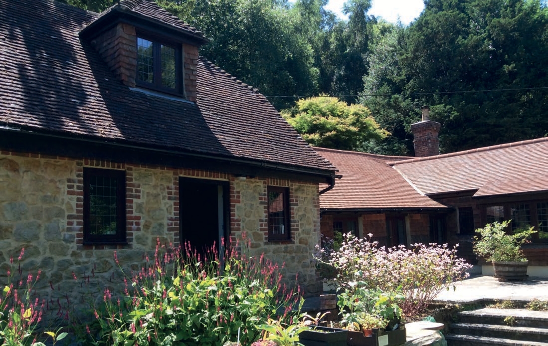 Old cottage with brown upvc windows - Glazerite uPVC