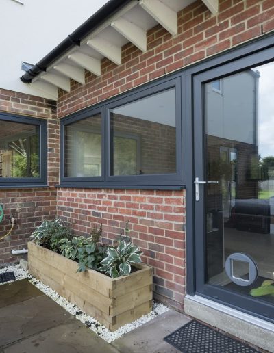 House with flush casement windows and Residence Collection door - Glazerite uPVC