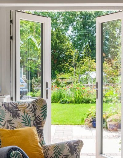 White French doors from the Residence Collection that open onto the patio and garden - Glazerite uPVC